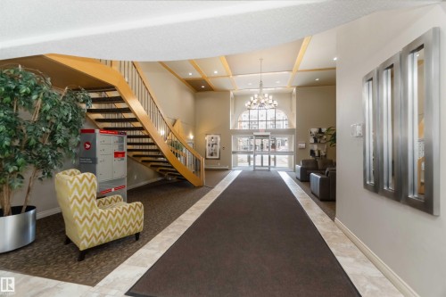 Common area with coffered ceiling and recessed lighting - 113 10311 111 Street, Edmonton, AB - Indoor Photo Showing Other Room