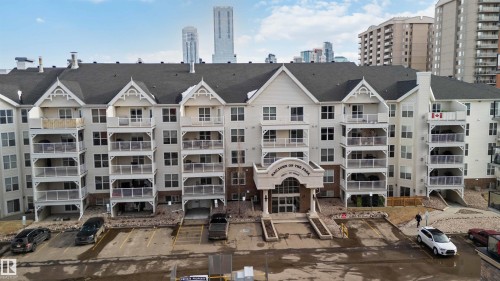 View of apartment building / complex with a city view and uncovered parking - 113 10311 111 Street, Edmonton, AB - Outdoor With Facade