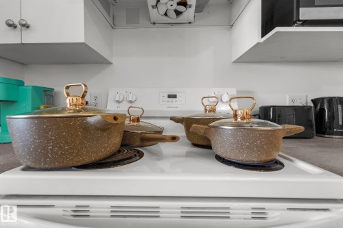 Kitchen view of white range with electric cooktop - 502 7511 171 Street Nw, Edmonton, AB - Indoor Photo Showing Kitchen