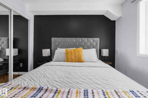 Bedroom featuring a closet and a textured ceiling - 502 7511 171 Street Nw, Edmonton, AB - Indoor Photo Showing Bedroom