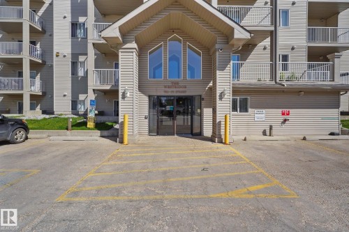 View of apartment building / complex with uncovered parking - 502 7511 171 Street Nw, Edmonton, AB - Outdoor With Balcony