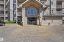 View of apartment building / complex with uncovered parking - 502 7511 171 Street Nw, Edmonton, AB  - Outdoor With Balcony 