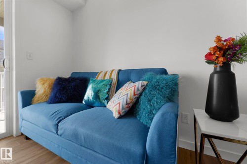 Living area featuring wood finished floors - 502 7511 171 Street Nw, Edmonton, AB - Indoor