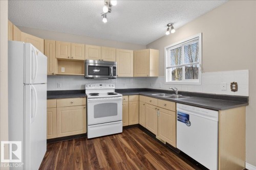 40 Birchglen Crescent, Leduc, AB - Indoor Photo Showing Kitchen With Double Sink