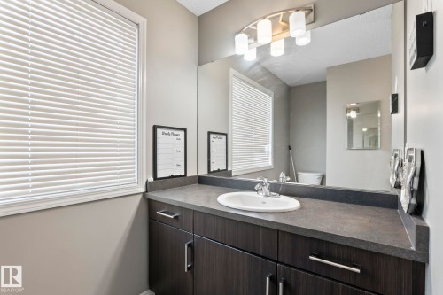 Half bath with toilet and vanity - 3221 Cherry Cres Sw, Edmonton, AB - Indoor Photo Showing Bathroom