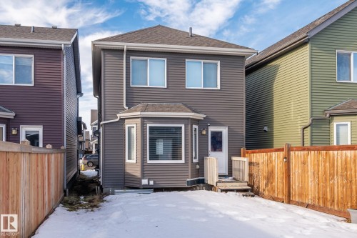 Snow covered house featuring roof with shingles - 3221 Cherry Cres Sw, Edmonton, AB - Outdoor