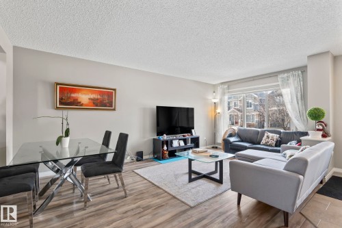 Living area with a textured ceiling and wood finished floors - 3221 Cherry Cres Sw, Edmonton, AB - Indoor Photo Showing Living Room