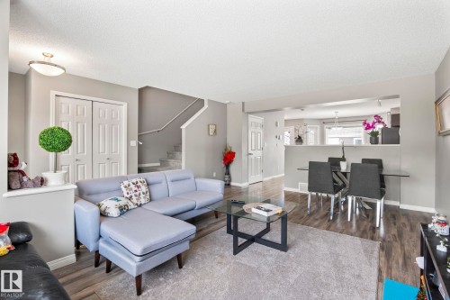 Living room with dark wood finished floors and a textured ceiling - 3221 Cherry Cres Sw, Edmonton, AB - Indoor Photo Showing Living Room
