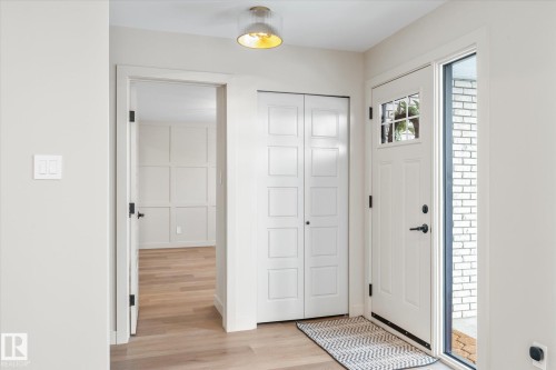 Entrance foyer featuring light wood finished floors and baseboards - 4120 108 Street, Edmonton, AB - Indoor Photo Showing Other Room