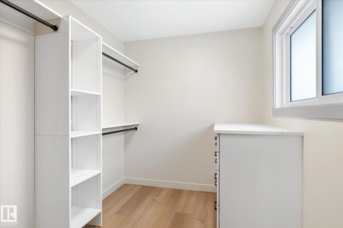 Walk in closet featuring light wood finished floors - 4120 108 Street, Edmonton, AB - Indoor With Storage