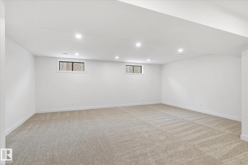 Below grade area featuring light carpet and recessed lighting - 4120 108 Street, Edmonton, AB - Indoor Photo Showing Basement