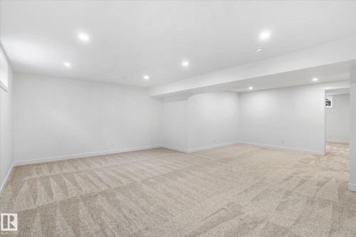 Finished basement featuring light colored carpet and recessed lighting - 4120 108 Street, Edmonton, AB - Indoor Photo Showing Other Room