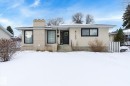 View of front of property with a chimney, brick siding, and stucco siding - 4120 108 Street, Edmonton, AB  - Outdoor 