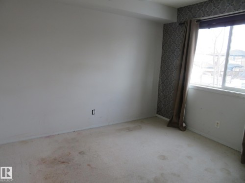 Empty room featuring carpet and baseboards - 2945 26 Street, Edmonton, AB - Indoor