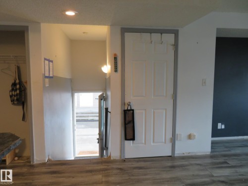 Interior space featuring dark wood-style flooring and recessed lighting - 2945 26 Street, Edmonton, AB - Indoor Photo Showing Other Room
