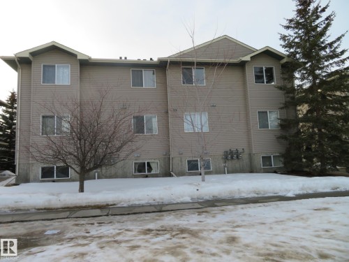 Snow covered property featuring a view of apartment building / complex - 2945 26 Street, Edmonton, AB - Outdoor