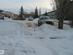 Yard layered in snow featuring a residential view - 