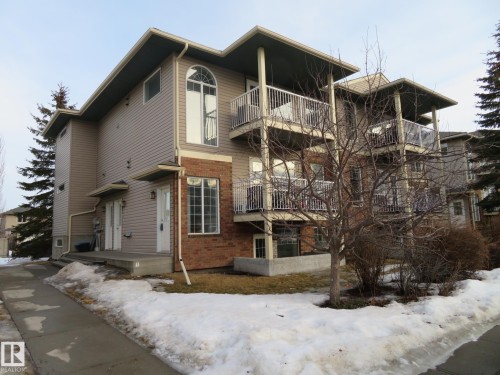 Snow covered property with a view of apartment building / complex - 2945 26 Street, Edmonton, AB - Outdoor With Balcony