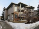Snow covered property with a view of apartment building / complex - 2945 26 Street, Edmonton, AB  - Outdoor With Balcony 