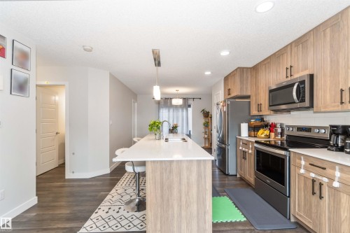3 3305 Orchards Link Sw, Edmonton, AB - Indoor Photo Showing Kitchen With Stainless Steel Kitchen