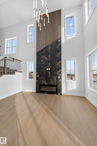 437 Crystal Creek Link, Leduc, AB - Indoor Photo Showing Other Room With Fireplace