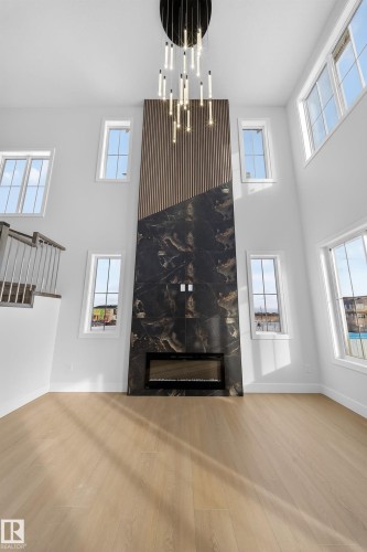 437 Crystal Creek Link, Leduc, AB - Indoor Photo Showing Other Room With Fireplace