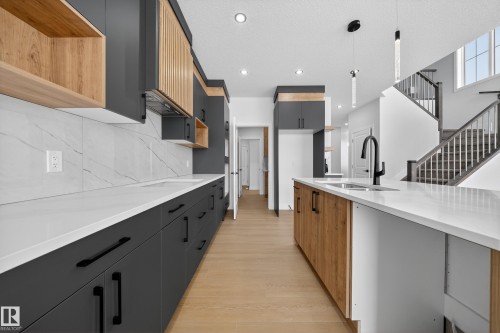 437 Crystal Creek Link, Leduc, AB - Indoor Photo Showing Kitchen With Double Sink With Upgraded Kitchen