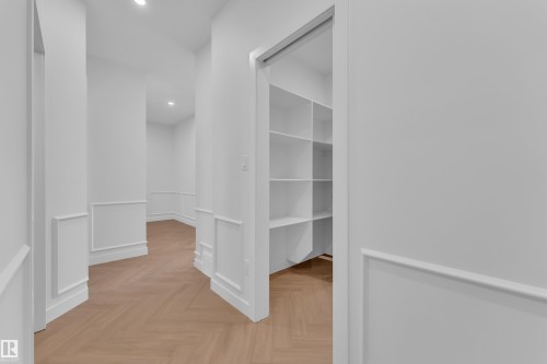 Corridor with wainscoting, parquet flooring, a decorative wall, and recessed lighting - 38 Grayson Green, Stony Plain, AB - Indoor