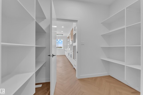 Walk in closet with parquet floors - 38 Grayson Green, Stony Plain, AB - Indoor With Storage