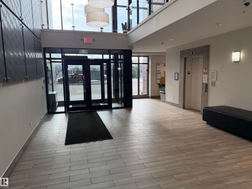 Building lobby with a high ceiling - 417 1004 Rosenthal Boulevard, Edmonton, AB - Indoor Photo Showing Other Room