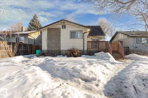 Snow covered back of property with a deck - 12232 135 Street, Edmonton, AB - Outdoor
