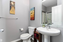 Full bath featuring a shower stall and toilet - 