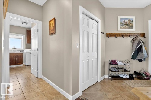 Mudroom featuring light tile patterned floors - 5019 48 Avenue, Chipman, AB - Indoor Photo Showing Other Room