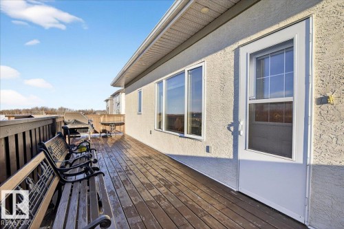 Wooden terrace with outdoor dining area - 5019 48 Avenue, Chipman, AB - Outdoor With Deck Patio Veranda With Exterior