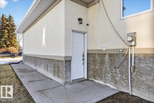 Property entrance featuring stucco siding - 5019 48 Avenue, Chipman, AB - Outdoor With Exterior