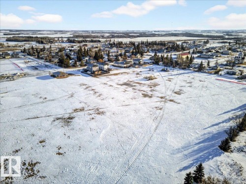 Snowy aerial view with a residential view - 5019 48 Avenue, Chipman, AB - Outdoor With View