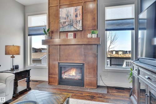 99 Shores Drive, Leduc, AB - Indoor Photo Showing Living Room With Fireplace
