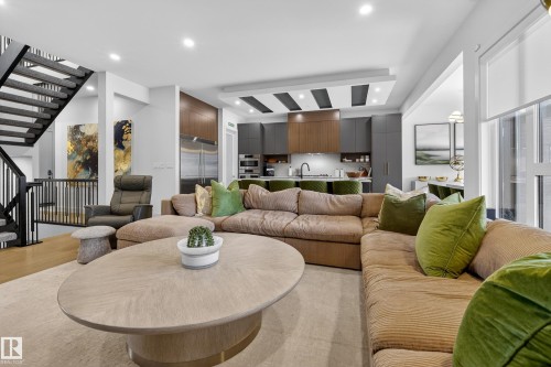 Living room featuring stairway and recessed lighting - 1132 Wahl Place, Edmonton, AB - Indoor Photo Showing Other Room