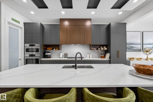 Kitchen featuring open shelves, gray cabinets, modern cabinets, recessed lighting, and light stone countertops - 1132 Wahl Place, Edmonton, AB - Indoor Photo Showing Kitchen With Upgraded Kitchen