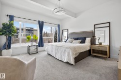 Bedroom with carpet floors and beam ceiling - 