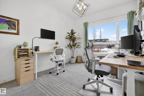 Office area featuring carpet flooring and suspended lighting - 1132 Wahl Place, Edmonton, AB - Indoor Photo Showing Office
