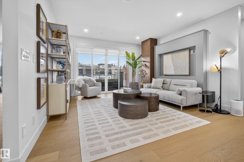 Living area with light wood-type flooring and recessed lighting - 1132 Wahl Place, Edmonton, AB - Indoor Photo Showing Living Room