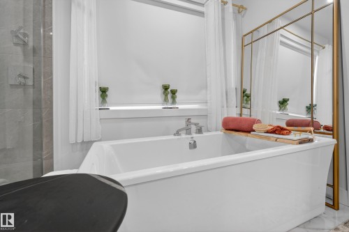 Full bathroom with a freestanding bath and tiled shower - 1132 Wahl Place, Edmonton, AB - Indoor Photo Showing Bathroom