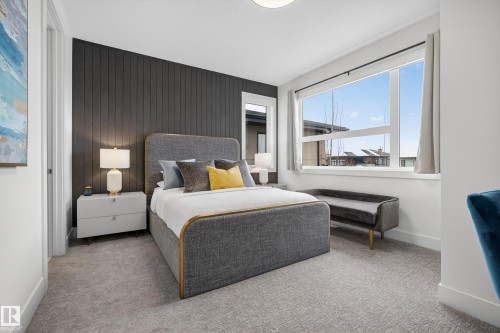Bedroom with carpet flooring and wood walls - 1132 Wahl Place, Edmonton, AB - Indoor Photo Showing Bedroom
