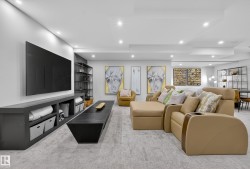Living room with light colored carpet and recessed lighting - 