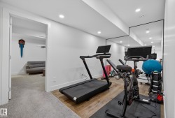 Exercise area featuring recessed lighting and light wood finished floors - 