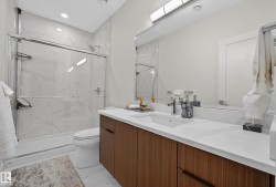 Full bath with vanity, a marble finish shower, light marble finish floors, and recessed lighting - 