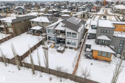 Snowy aerial view featuring a residential view - 