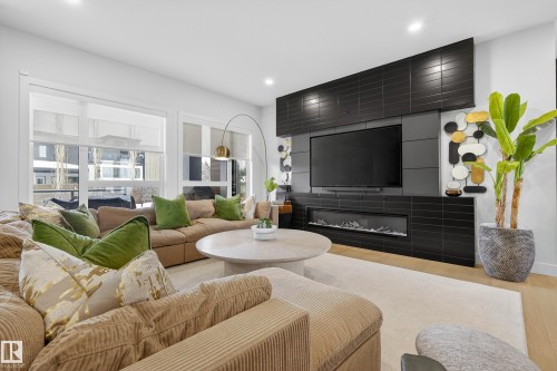 Living area with wood finished floors and recessed lighting - 1132 Wahl Place, Edmonton, AB - Indoor Photo Showing Living Room