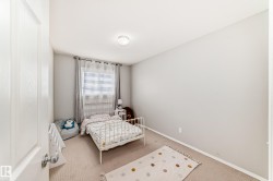 Carpeted bedroom with baseboards - 
